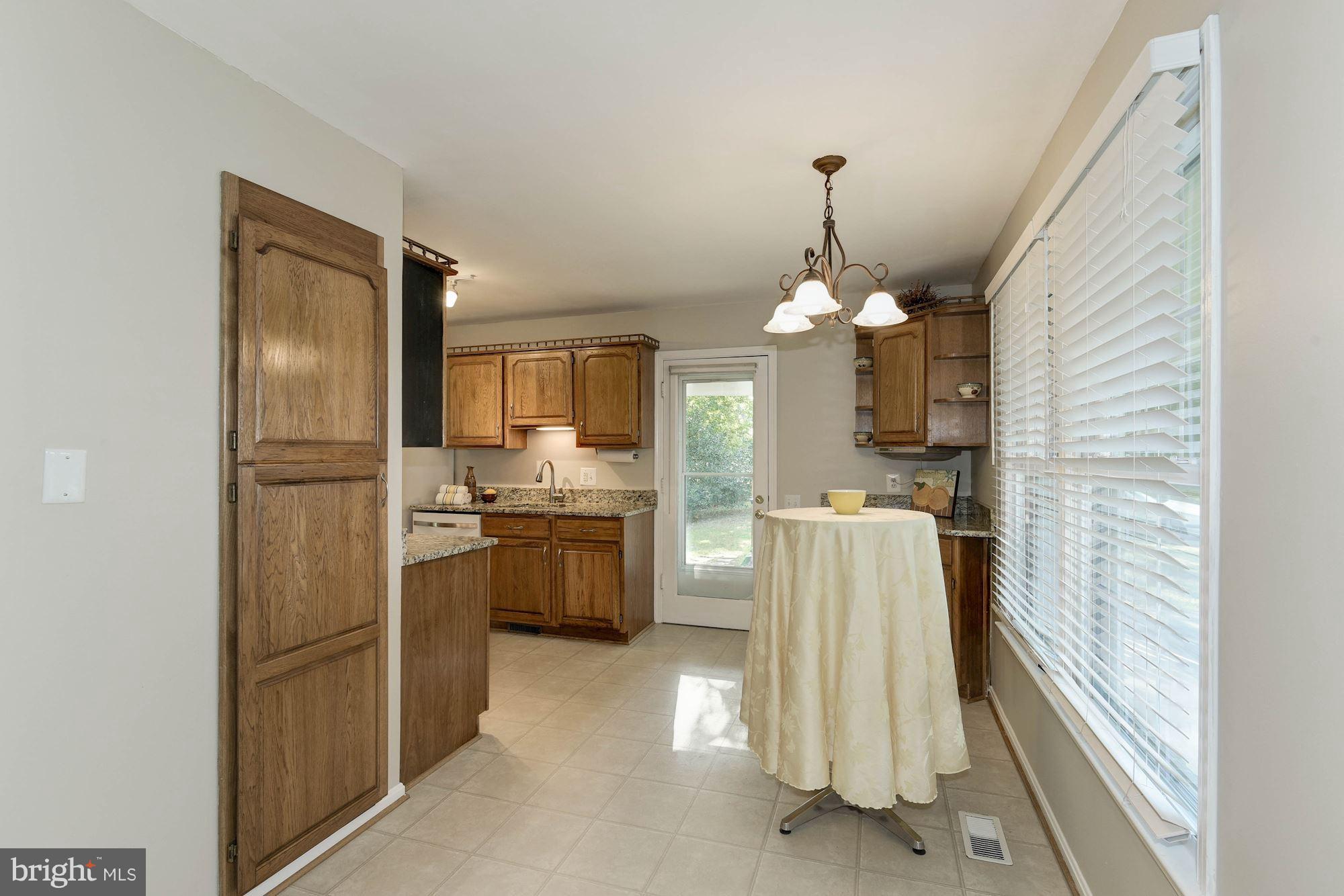 4723 Pickett Road Fairfax, VA 22032 - Photo 7 of 30 Friendly Informal Kitchen Dining with Huge Pantry