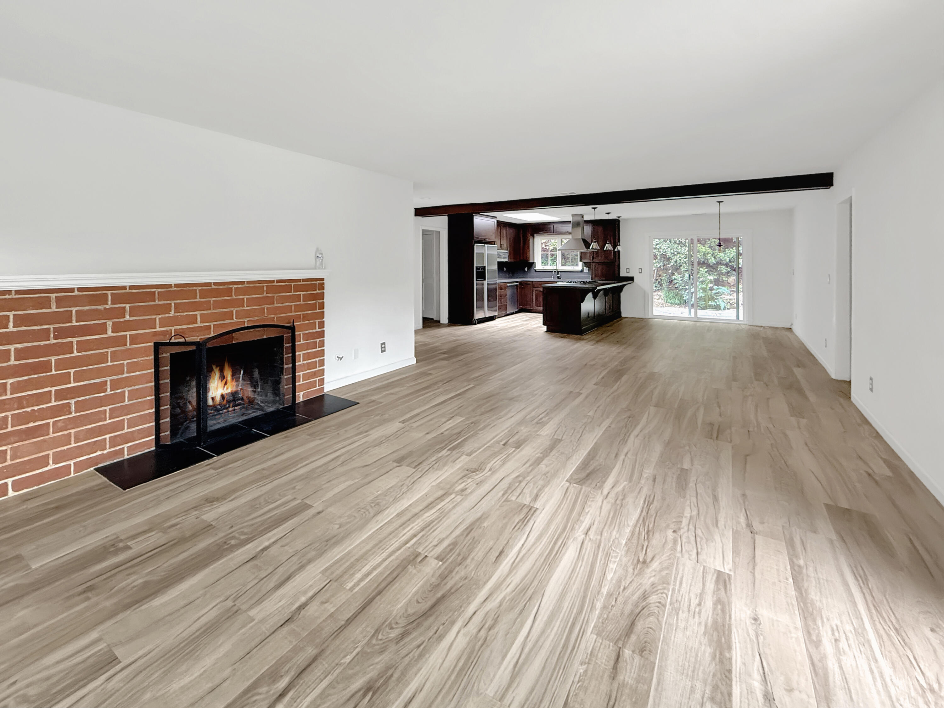 2020 Foothill Road Santa Barbara, CA 93105 - Photo 6 of 11 a view of an empty room with wooden floor fireplace and a window