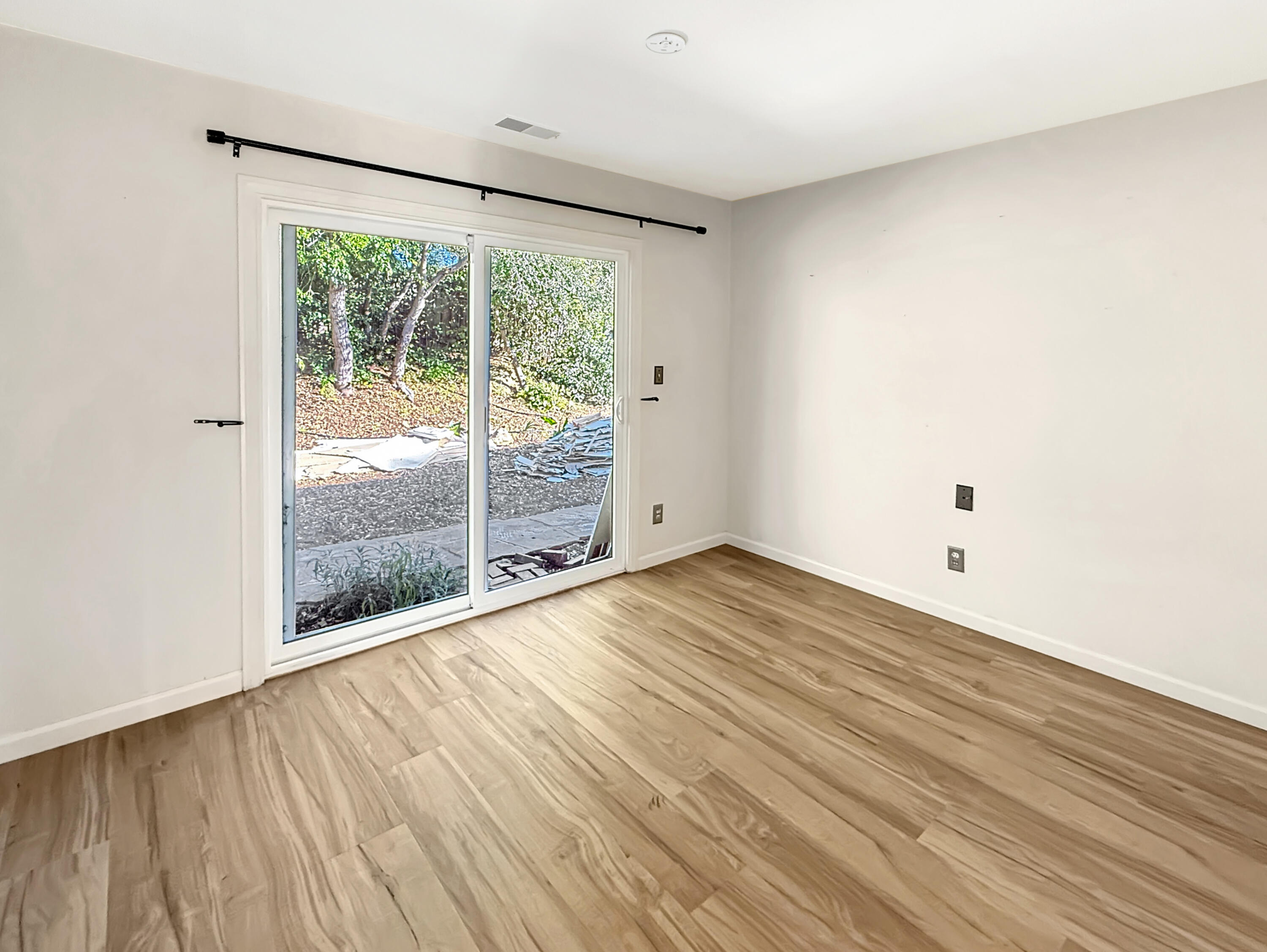 2020 Foothill Road Santa Barbara, CA 93105 - Photo 9 of 11 a view of empty room with wooden floor and fan