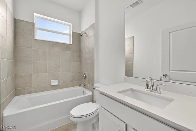 a bathroom with a sink a toilet and a bathtub