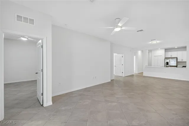 a view of a livingroom with a kitchen