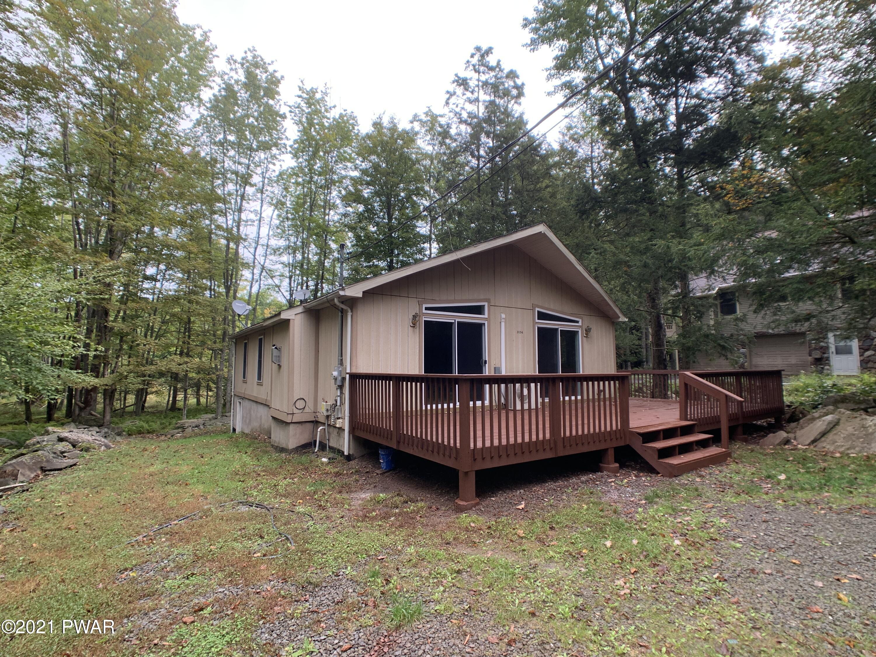267 North Northgate Road Lake Ariel, PA 18436 - Photo 2 of 29 a view of a house with a yard and deck