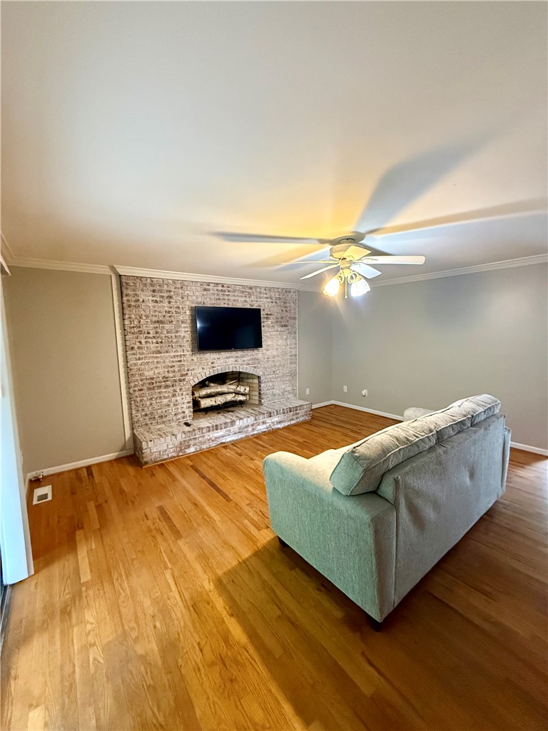 1200 Loran Pointe Circle Seneca, SC 29672 - Photo 16 of 29 This inviting living area boasts hardwood floors and a brick fireplace.