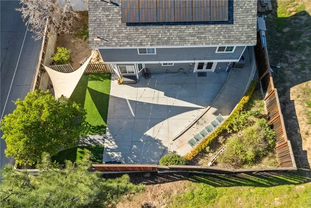 aerial view of a house with a yard