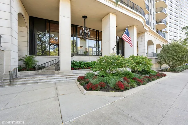 a view of a house with potted plants