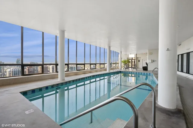 a view of a living room and kitchen with furniture