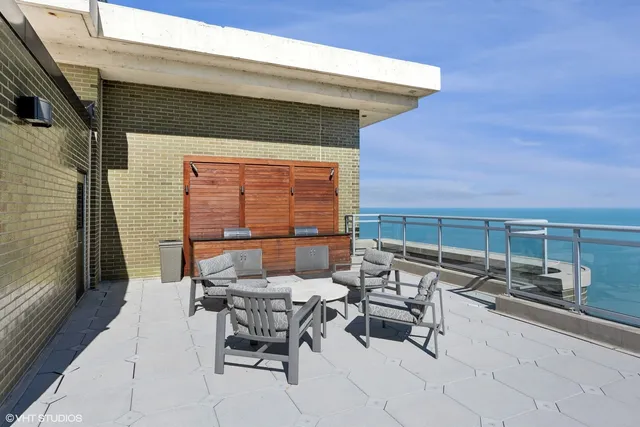 a view of balcony with furniture