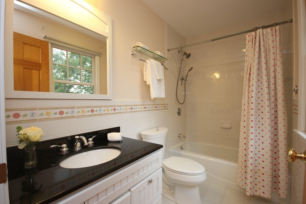 9 Orourke Path Newton, MA 02459 - Photo 20 of 30 a bathroom with a granite countertop sink toilet and shower