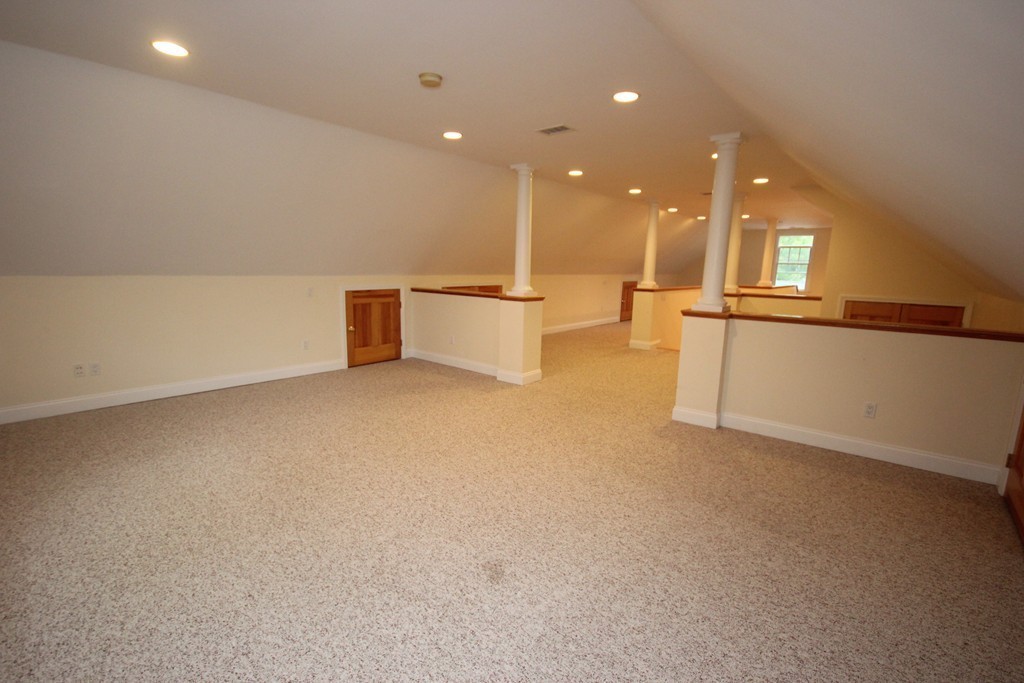 9 Orourke Path Newton, MA 02459 - Photo 23 of 30 a view of an empty room with kitchen