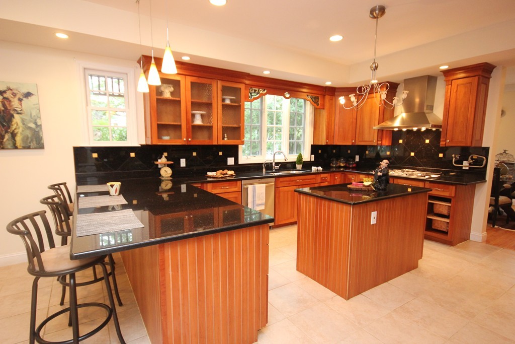 9 Orourke Path Newton, MA 02459 - Photo 3 of 30 a kitchen with stainless steel appliances granite countertop a sink stove and refrigerator