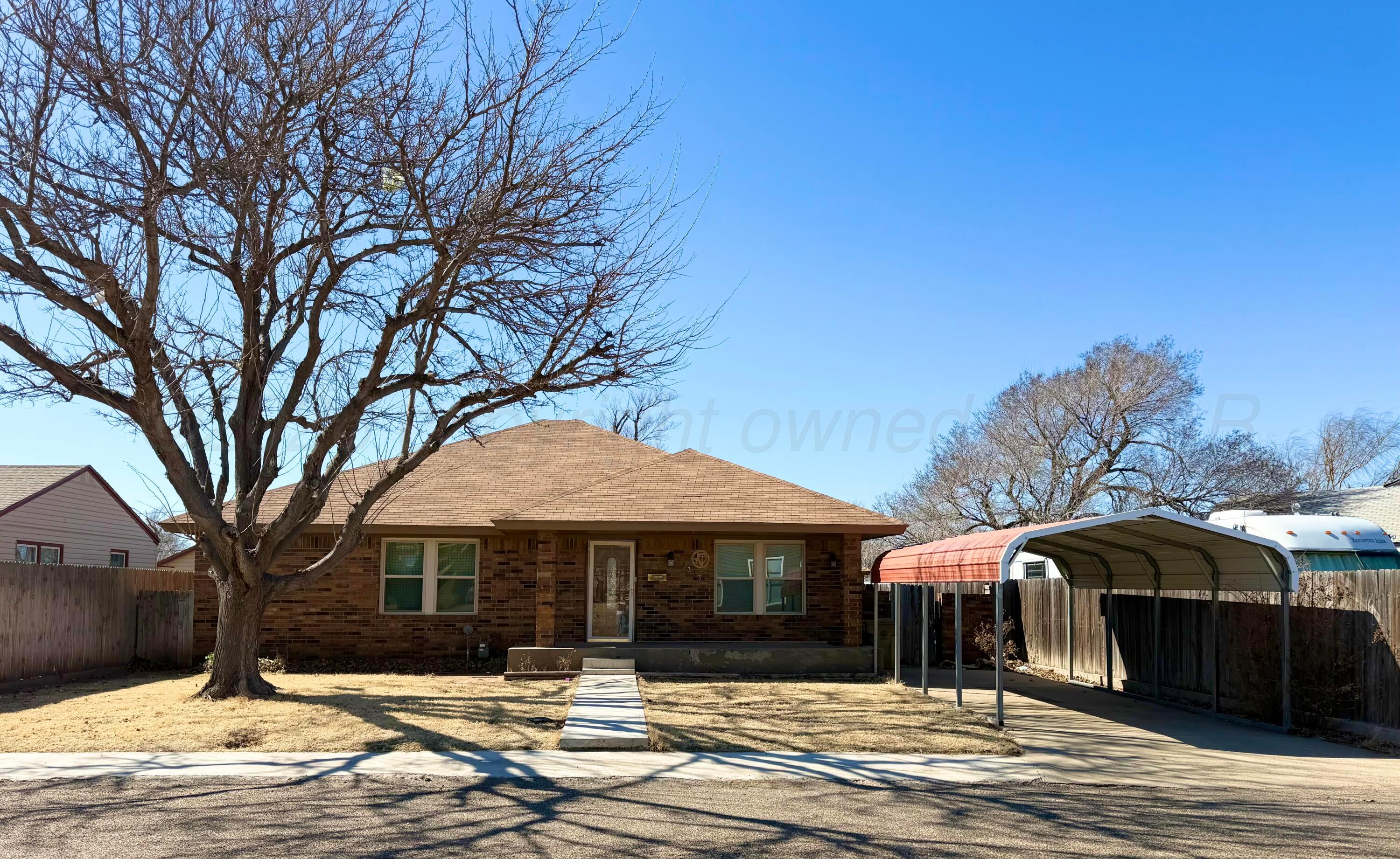 1313 Davis Street Borger, TX 79007 - Photo 1 of 15 a front view of a house with a yard