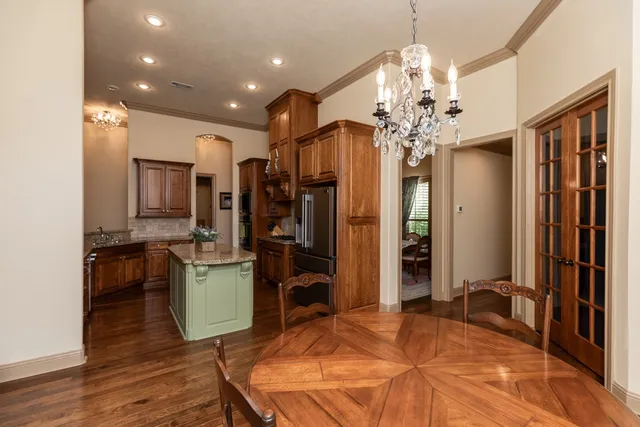 a bedroom with furniture and a chandelier