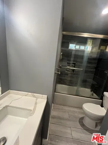 a bathroom with a bathtub and toilet