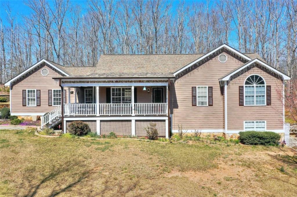 281 Mt Vernon Road Northwest Monroe, GA 30655 - Photo 1 of 1 a house view with a garden space