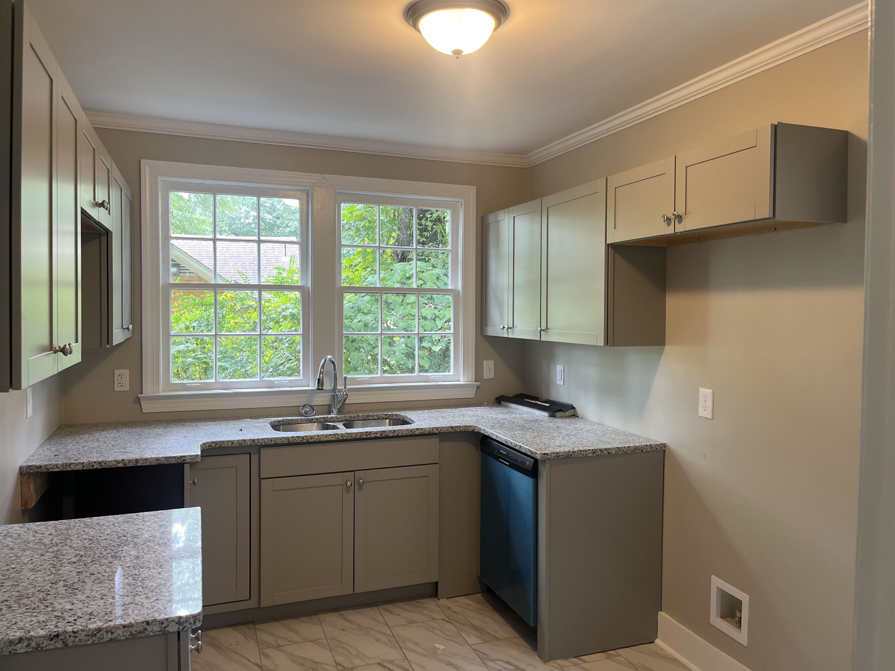 754 Hale Road Memphis, TN 38116 - Photo 6 of 9 a kitchen with a sink stove and cabinets