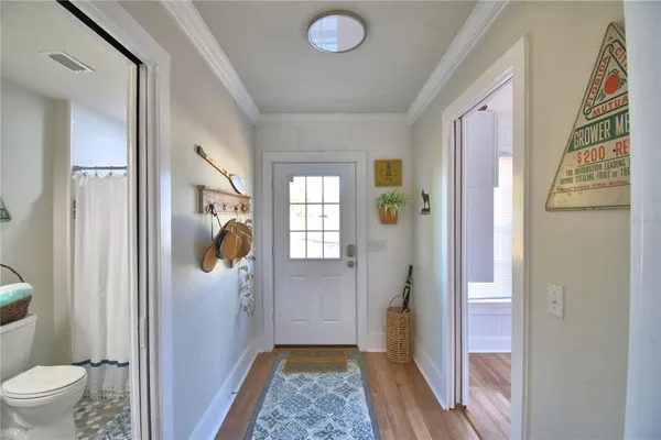 a bathroom with a toilet sink vanity and mirror
