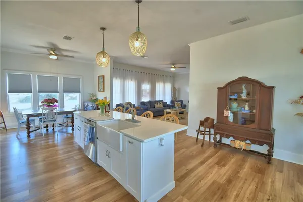 a dining room with furniture and wooden floor