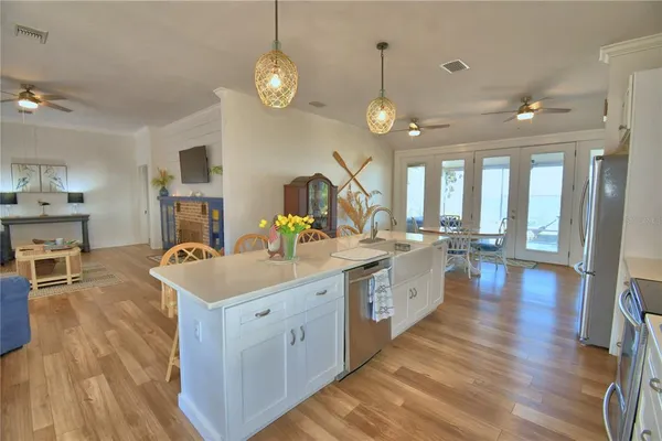 a large kitchen with a table and chairs