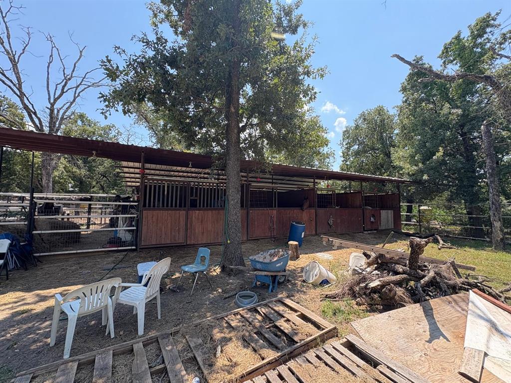 12746 Fish Road Dallas, TX 75253 - Photo 11 of 15 a view of backyard with outdoor seating and trees