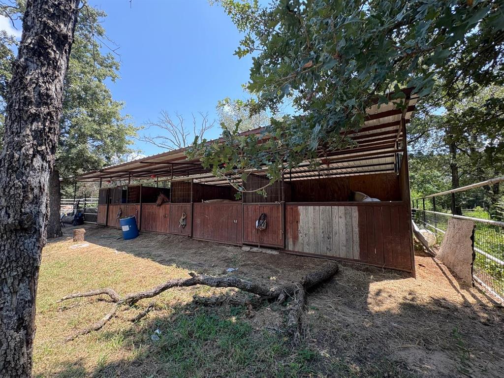 12746 Fish Road Dallas, TX 75253 - Photo 13 of 15 a view of a house with a yard in a forest