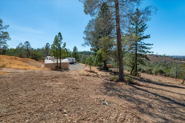 a view of a backyard of the house