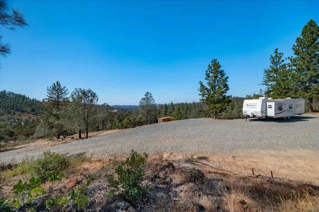 a view of a road with a building in the background
