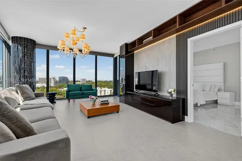 a kitchen with stainless steel appliances a sink a stove and microwave