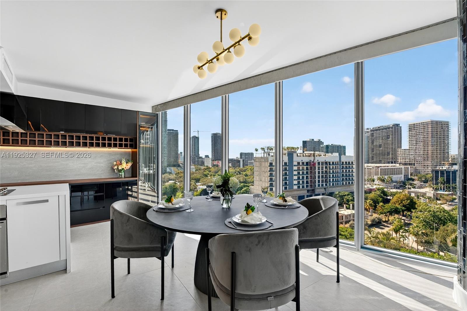 601 Northeast 36th Street, Unit 1101 Miami, FL 33137 - Photo 14 of 69 a view of a dining room with furniture window and wooden floor