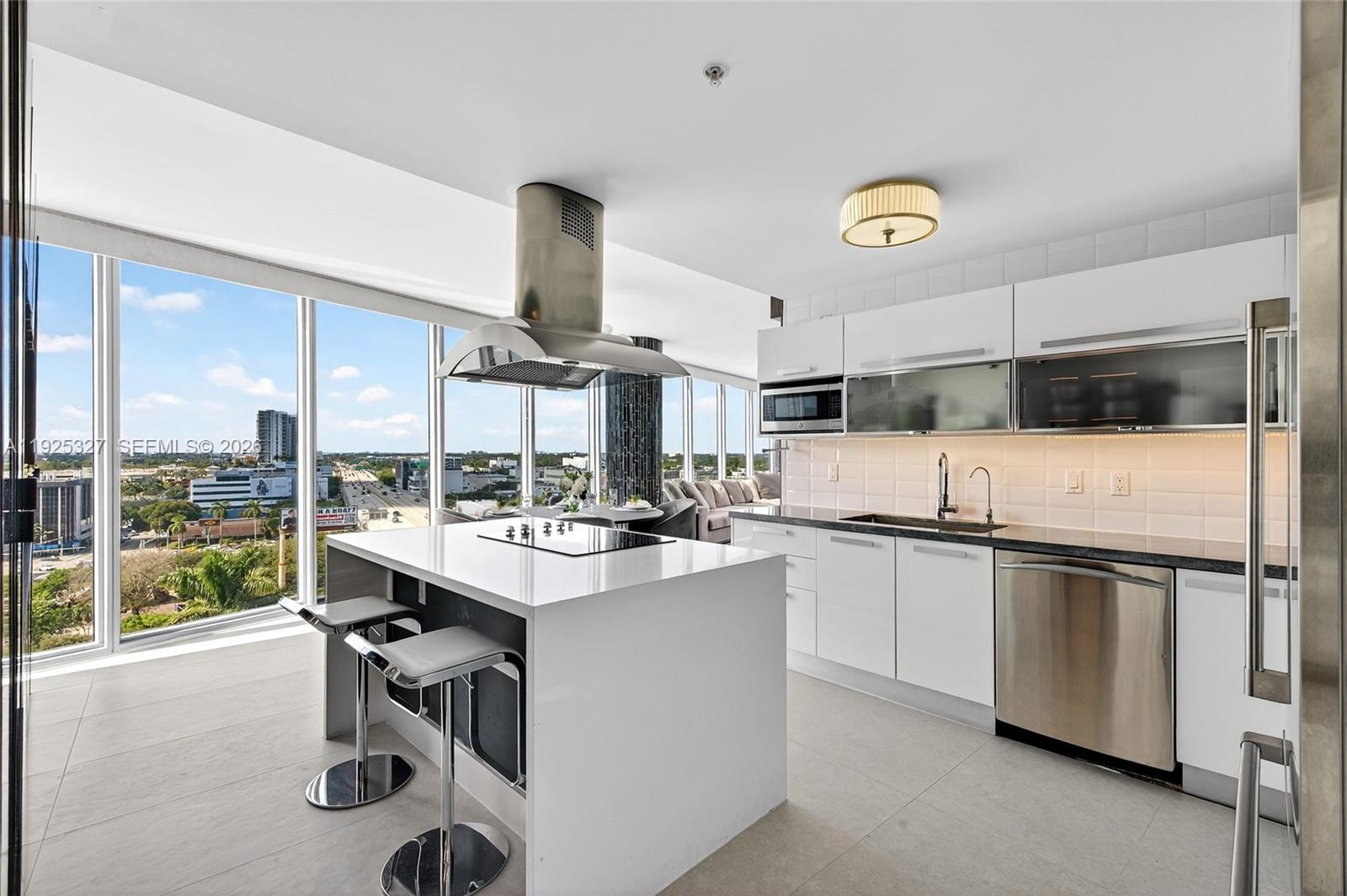 601 Northeast 36th Street, Unit 1101 Miami, FL 33137 - Photo 25 of 69 a kitchen with stainless steel appliances a sink a stove and a refrigerator