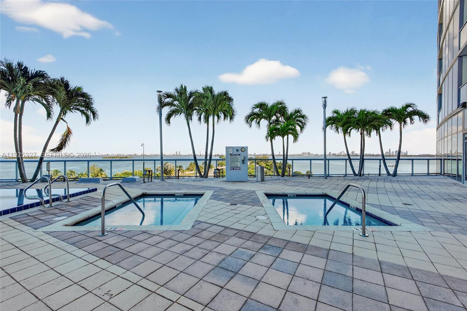 601 Northeast 36th Street, Unit 1101 Miami, FL 33137 - Photo 59 of 69 a view of a swimming pool with lounge chairs