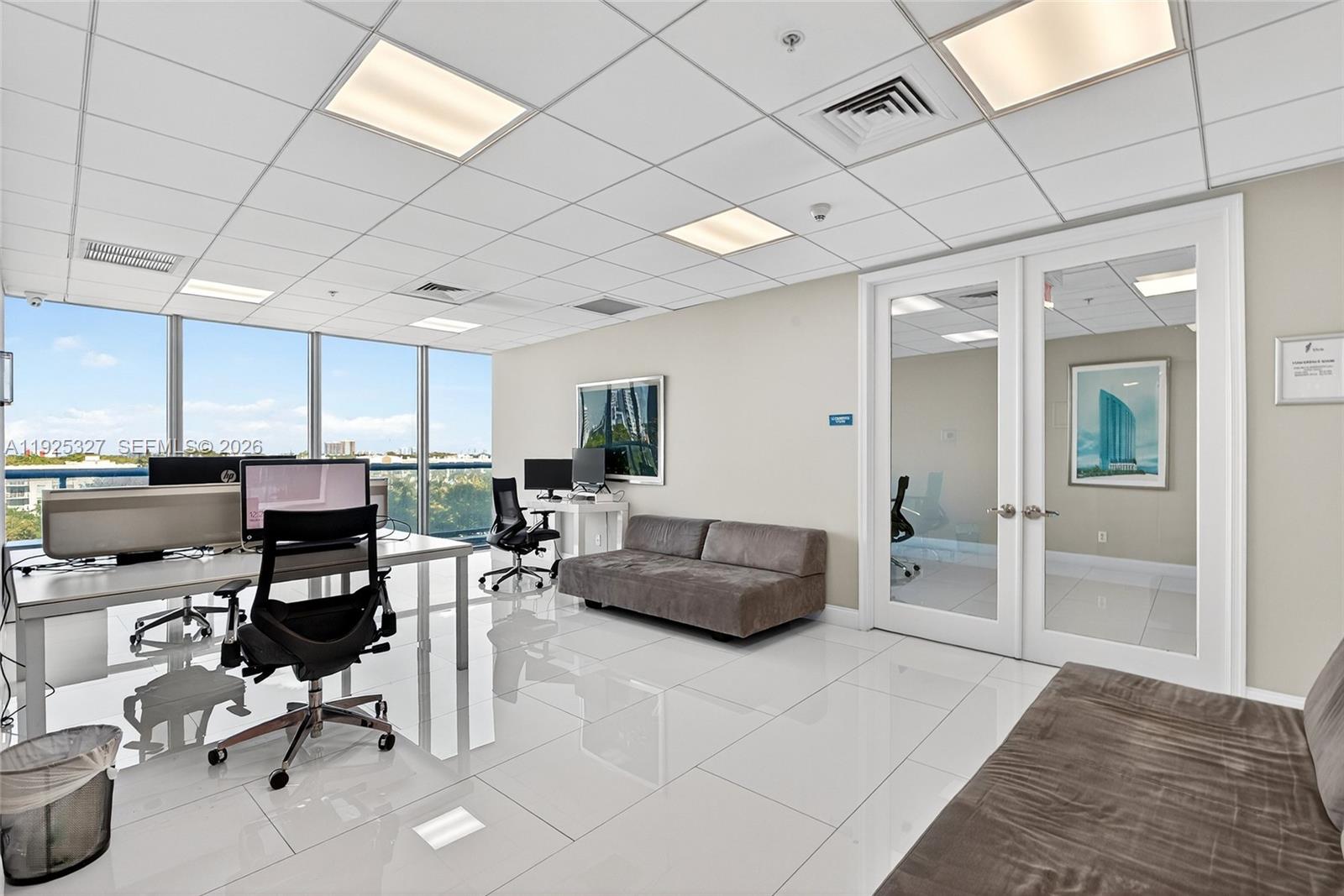 601 Northeast 36th Street, Unit 1101 Miami, FL 33137 - Photo 63 of 69 a living room with furniture and a large window