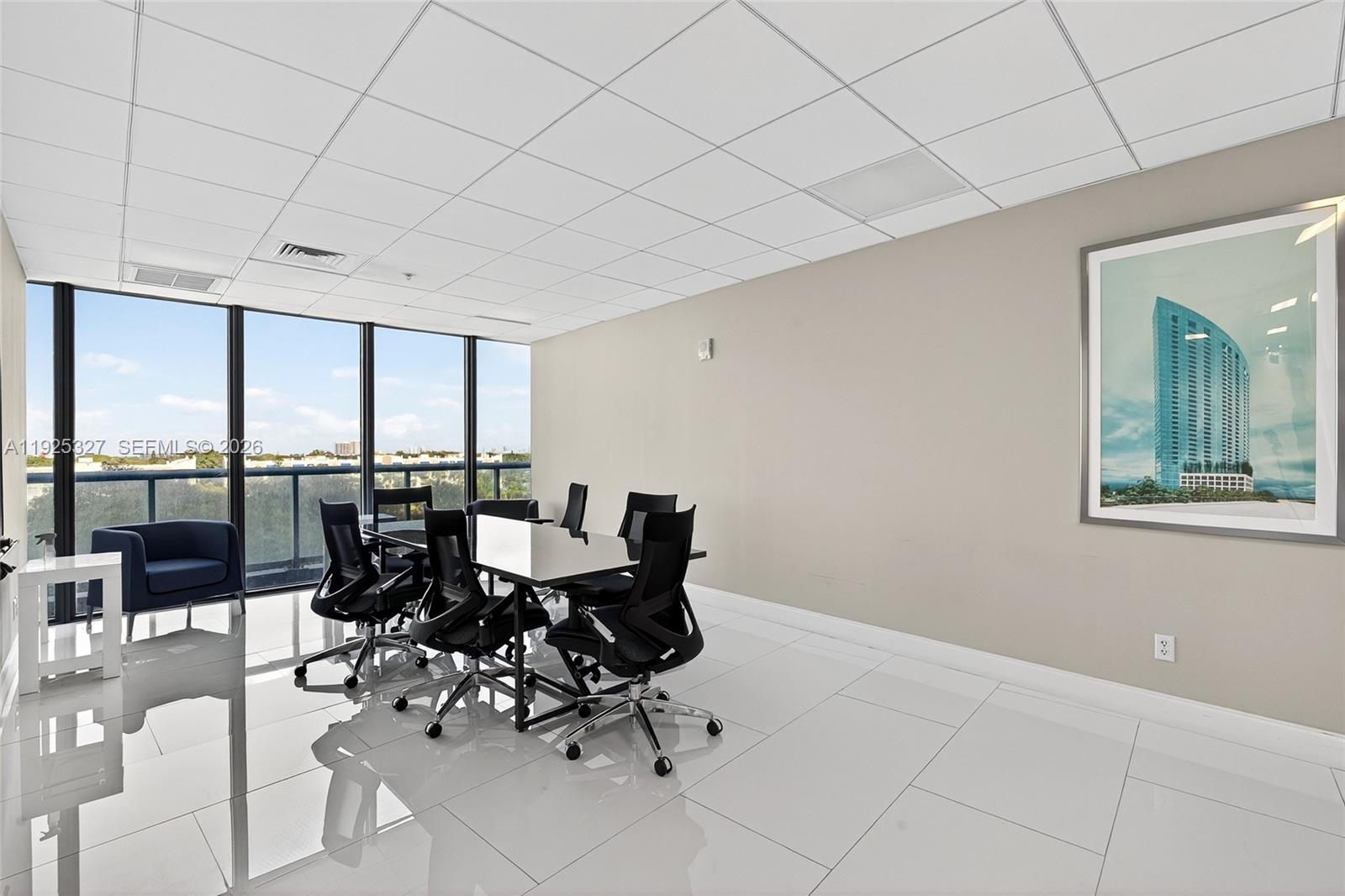 601 Northeast 36th Street, Unit 1101 Miami, FL 33137 - Photo 64 of 69 a dining room with furniture and floor to ceiling windows