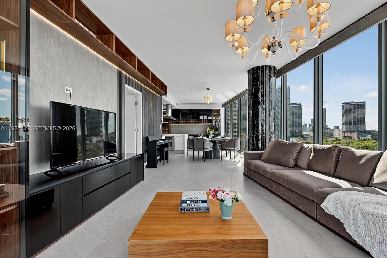 601 Northeast 36th Street, Unit 1101 Miami, FL 33137 - Photo 8 of 69 a living room with furniture and a flat screen tv