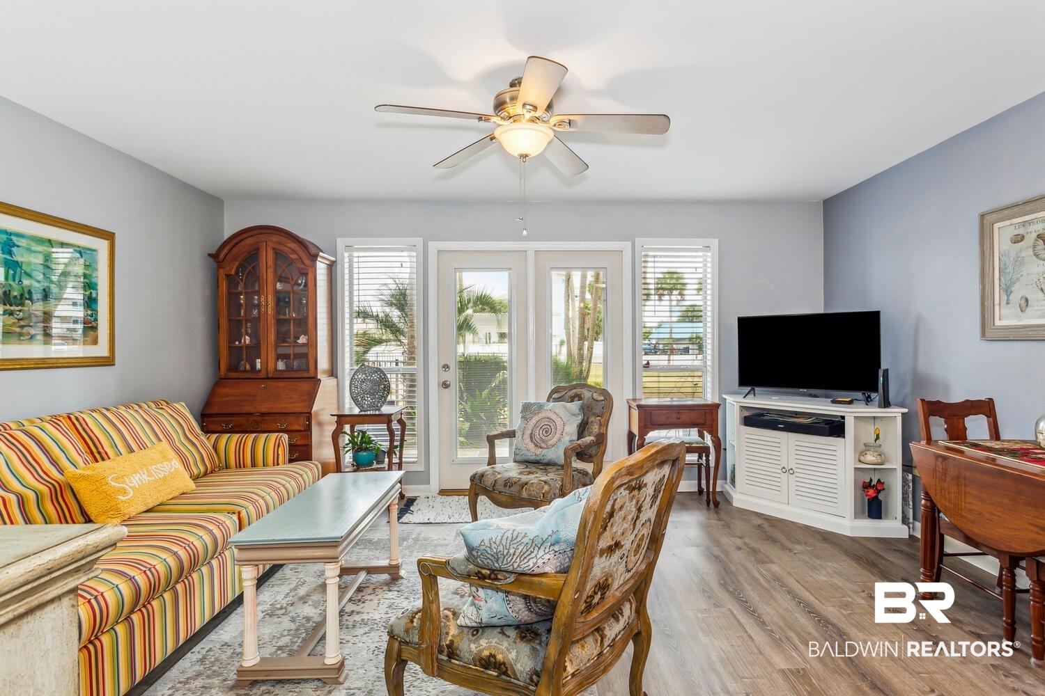 13551 Johnson Beach Road, Unit 112E Pensacola, FL 32507 - Photo 7 of 42 Living room with ceiling fan and light wood-type flooring