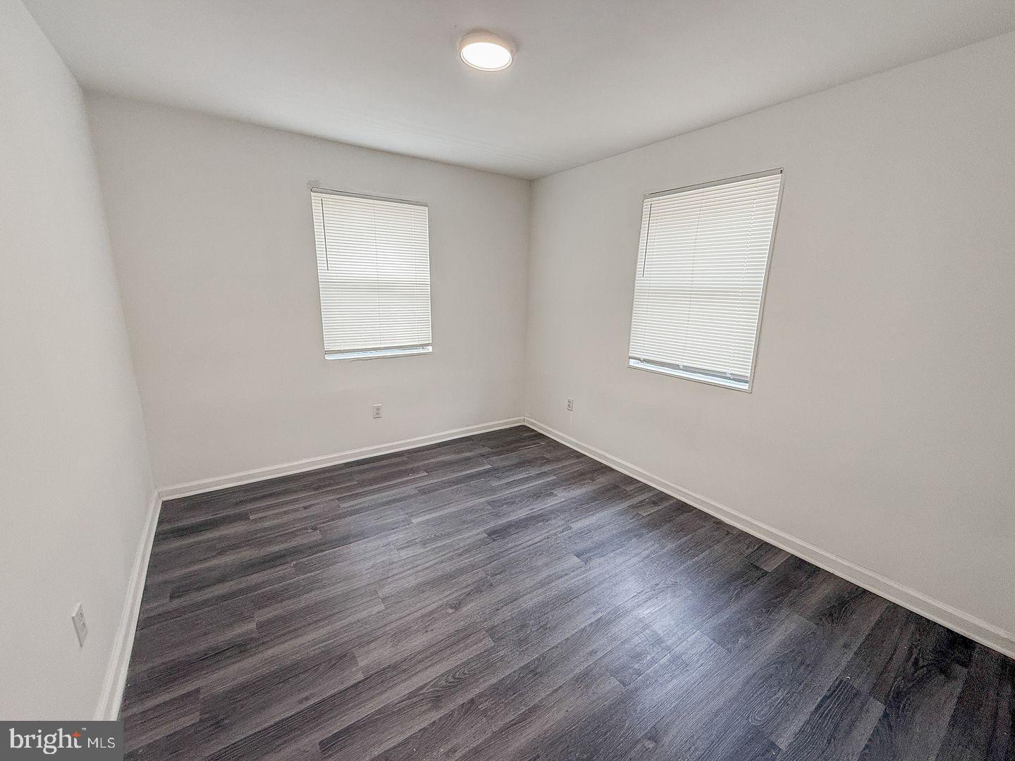 2100 Channing Street Northeast, Unit 1B Washington, DC 20018 - Photo 5 of 6 Bright and airy room with modern flooring.