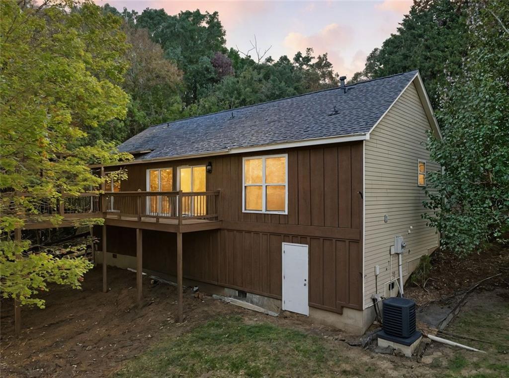 1512 Upper Sassafras Road Jasper, GA 30143 - Photo 9 of 41 a backyard of a house with table and chairs