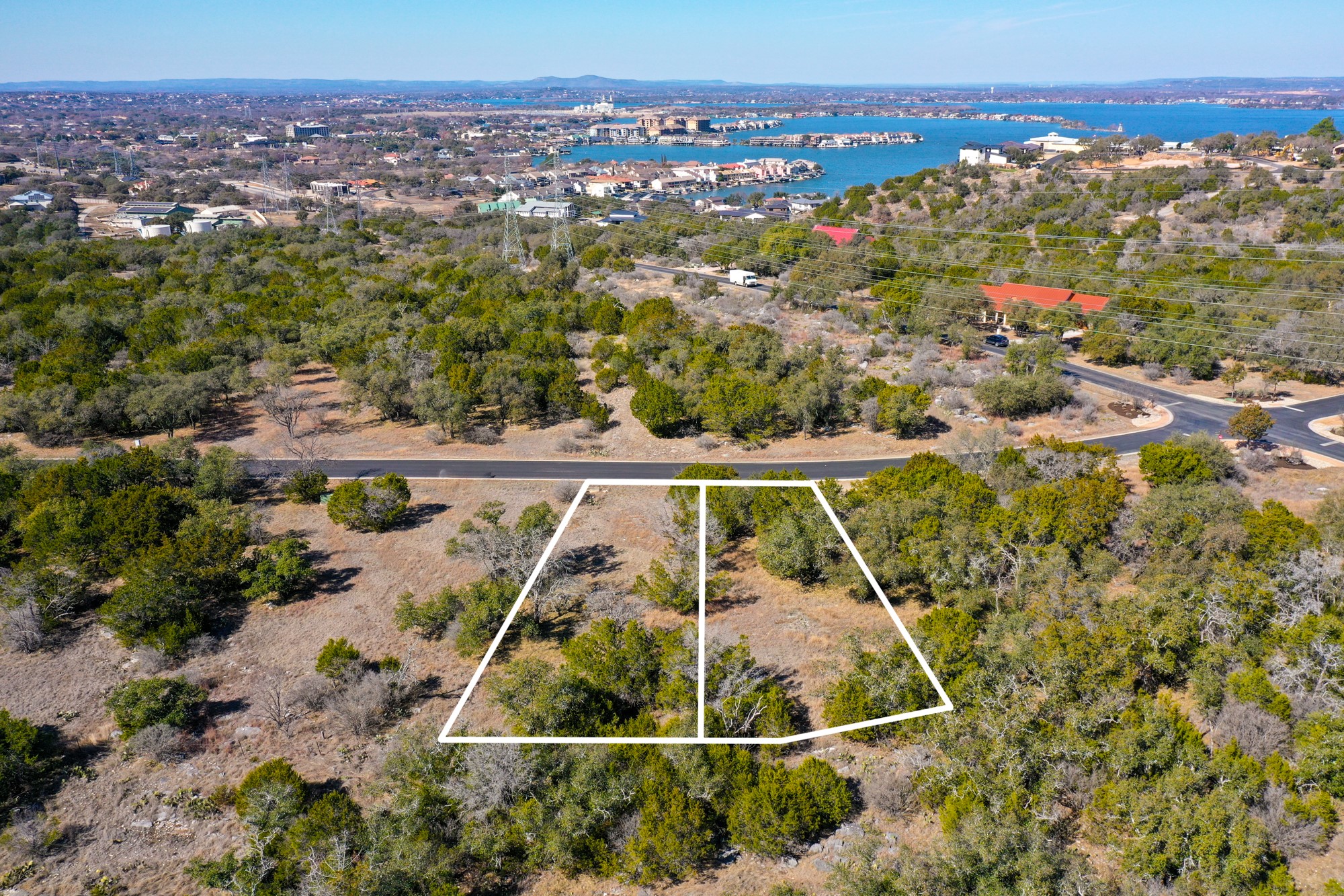 40018 Hi Ridge Road Horseshoe Bay, TX 78657 - Photo 1 of 8 Elevated view lines outline this hillside property overlooking a vast blue lake.