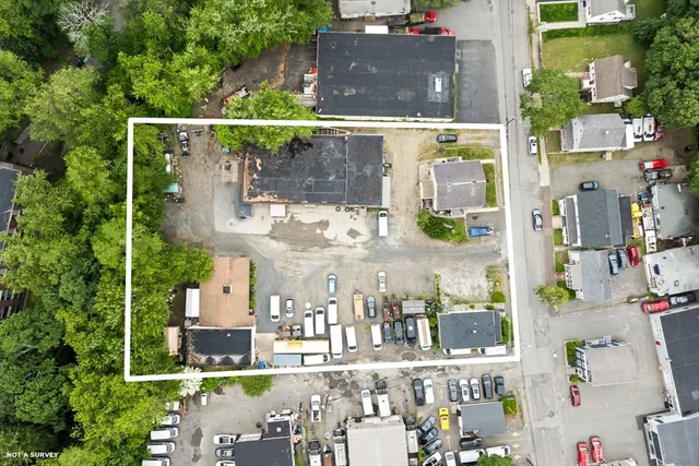 an aerial view of street with an outdoor space