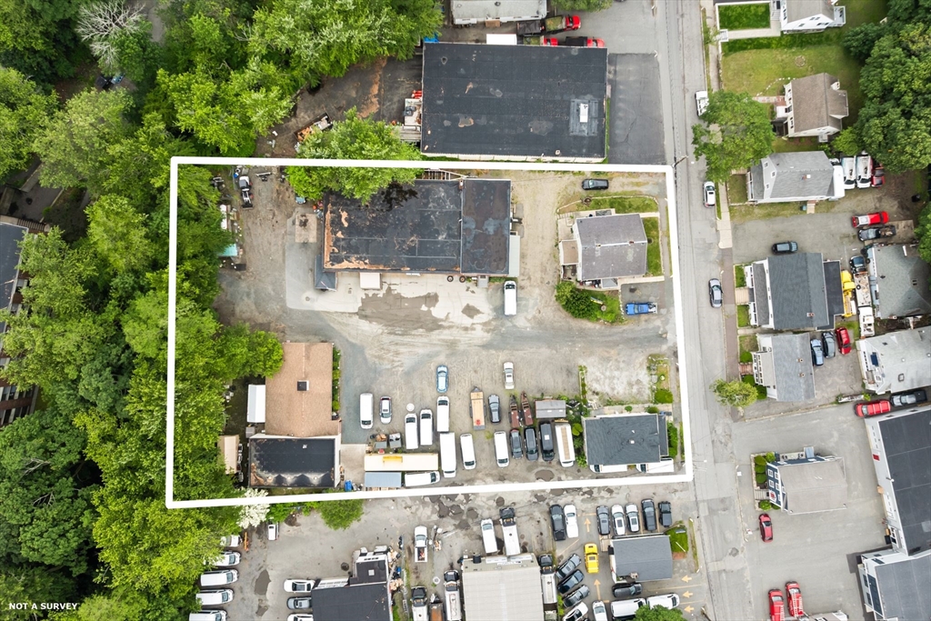 an aerial view of street with an outdoor space