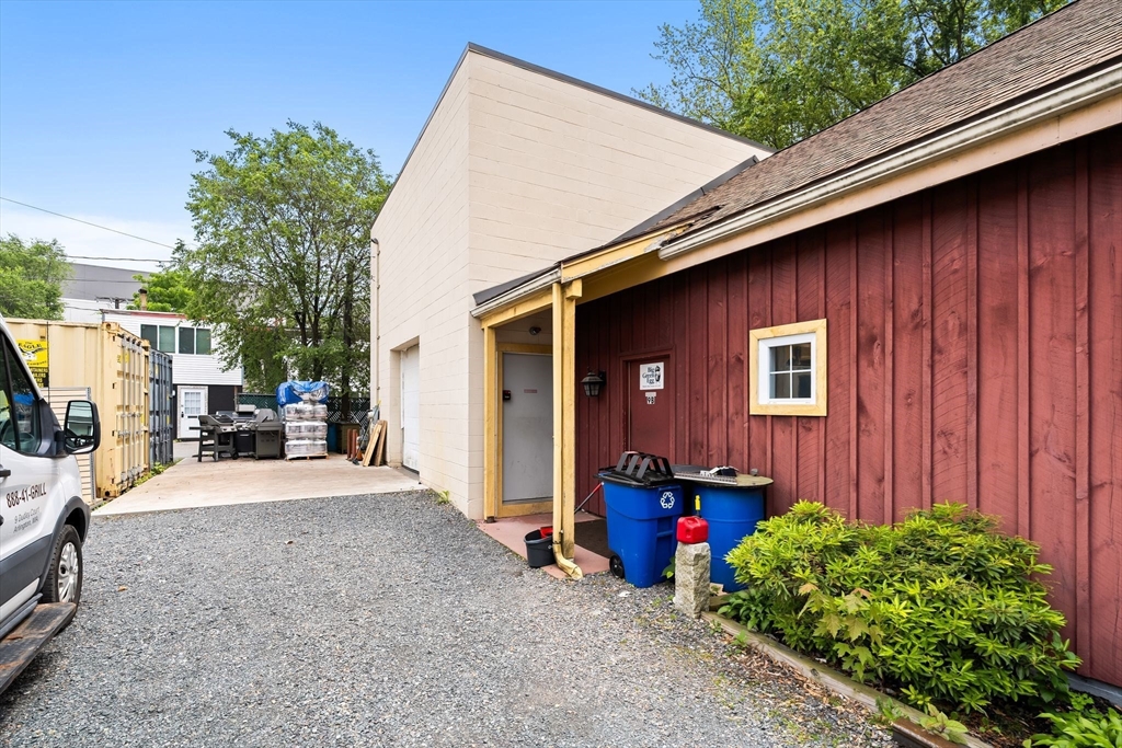 52-56 Dudley Street Arlington, MA 02476 - Photo 13 of 38 a view of a house with backyard and sitting area