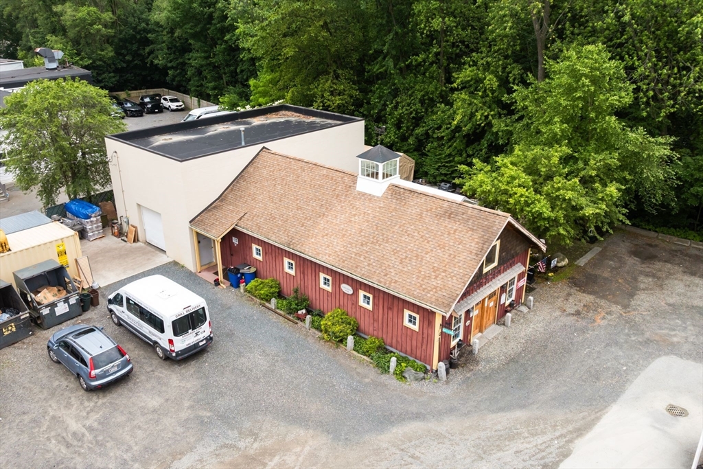52-56 Dudley Street Arlington, MA 02476 - Photo 14 of 38 a car parked in front of a house with car parked