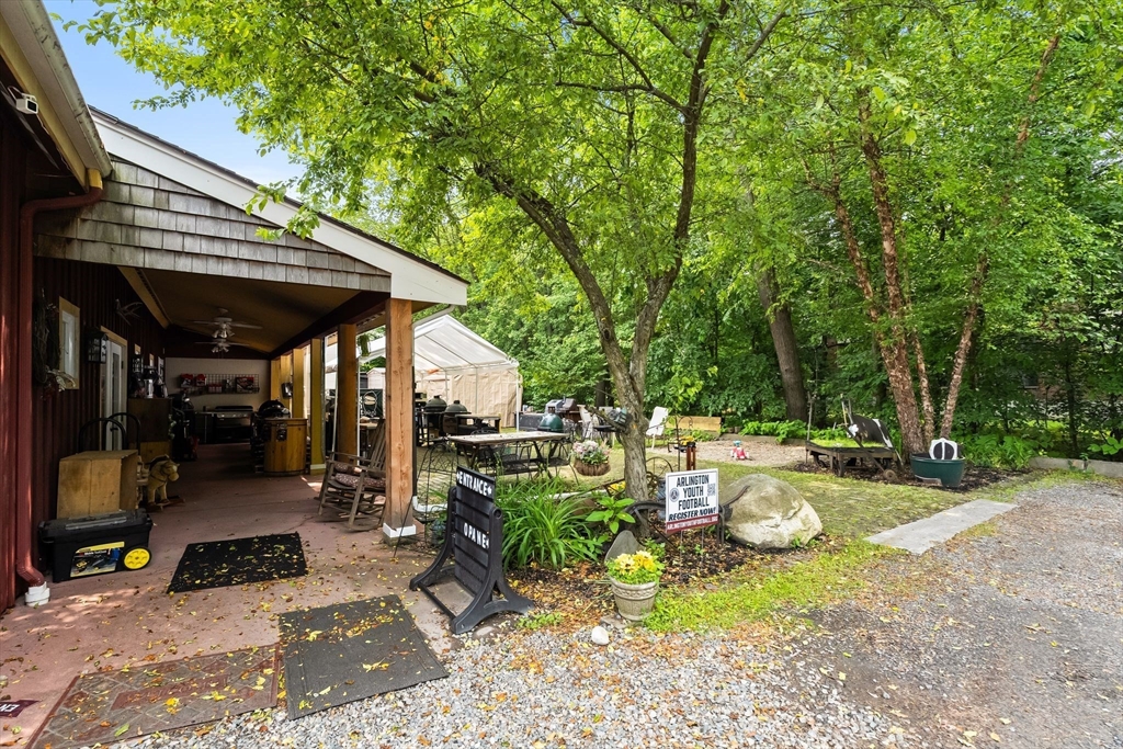 52-56 Dudley Street Arlington, MA 02476 - Photo 16 of 38 a view of a patio with table and chairs under an umbrella