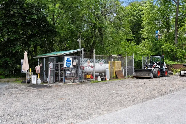 a view of a car park in front of house