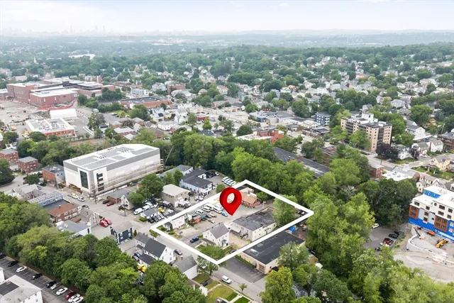 an aerial view of residential houses with outdoor space