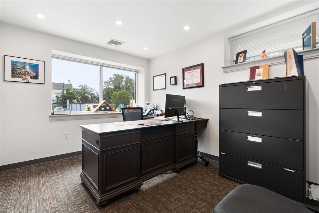 52-56 Dudley Street Arlington, MA 02476 - Photo 27 of 38 a room with a window and a table in it