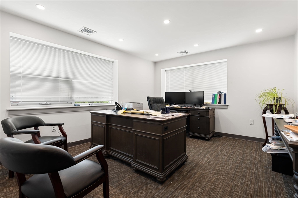 52-56 Dudley Street Arlington, MA 02476 - Photo 28 of 38 a living room with furniture and a flat screen tv