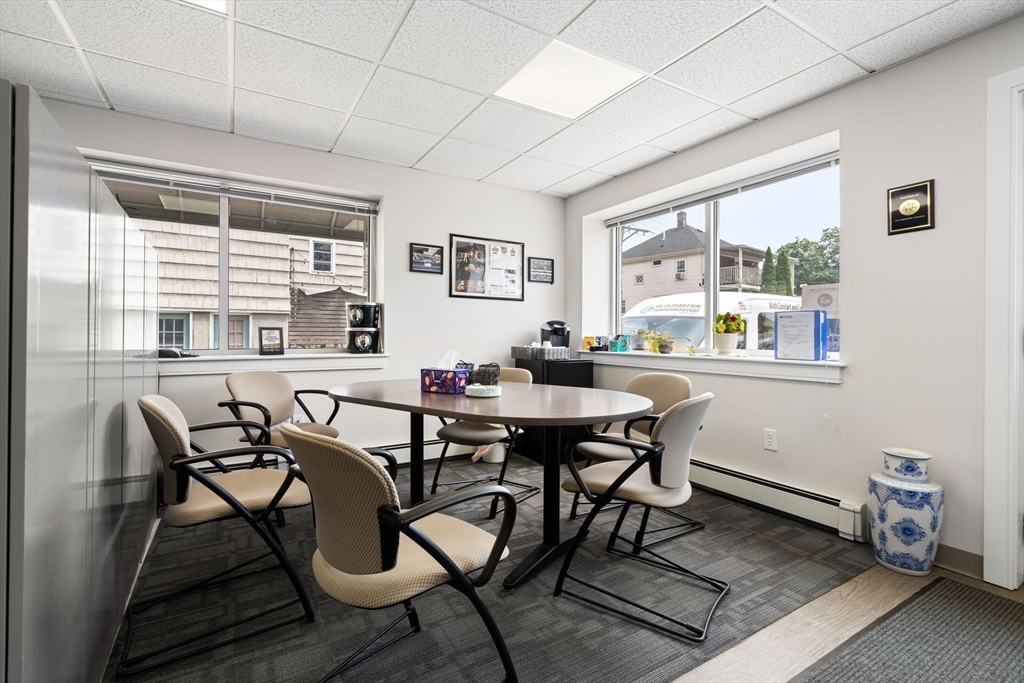 52-56 Dudley Street Arlington, MA 02476 - Photo 33 of 38 a view of a dining room with furniture window and outside view