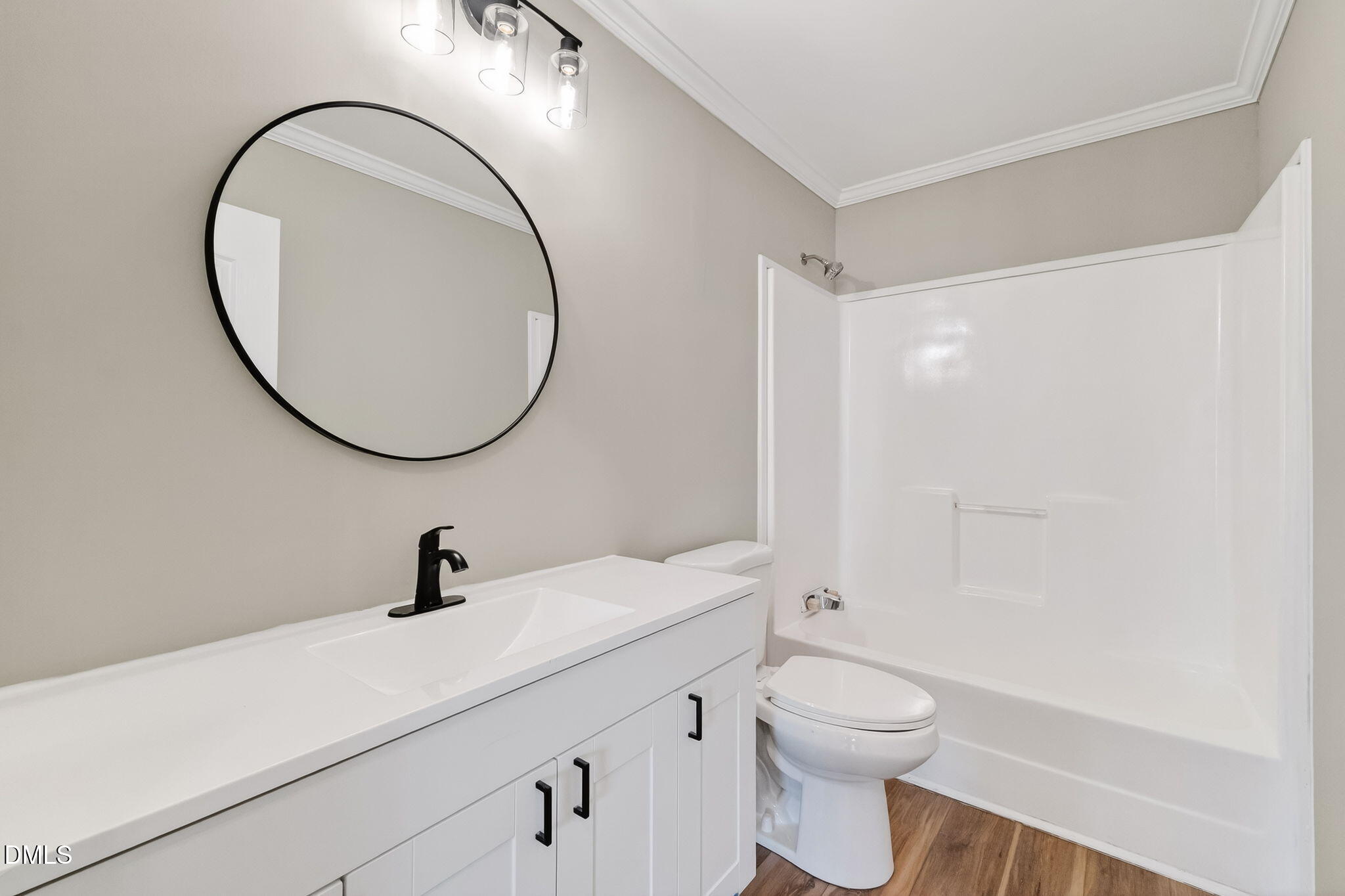 10015 Smith Road Middlesex, NC 27557 - Photo 31 of 48 a bathroom with a toilet a sink and a mirror