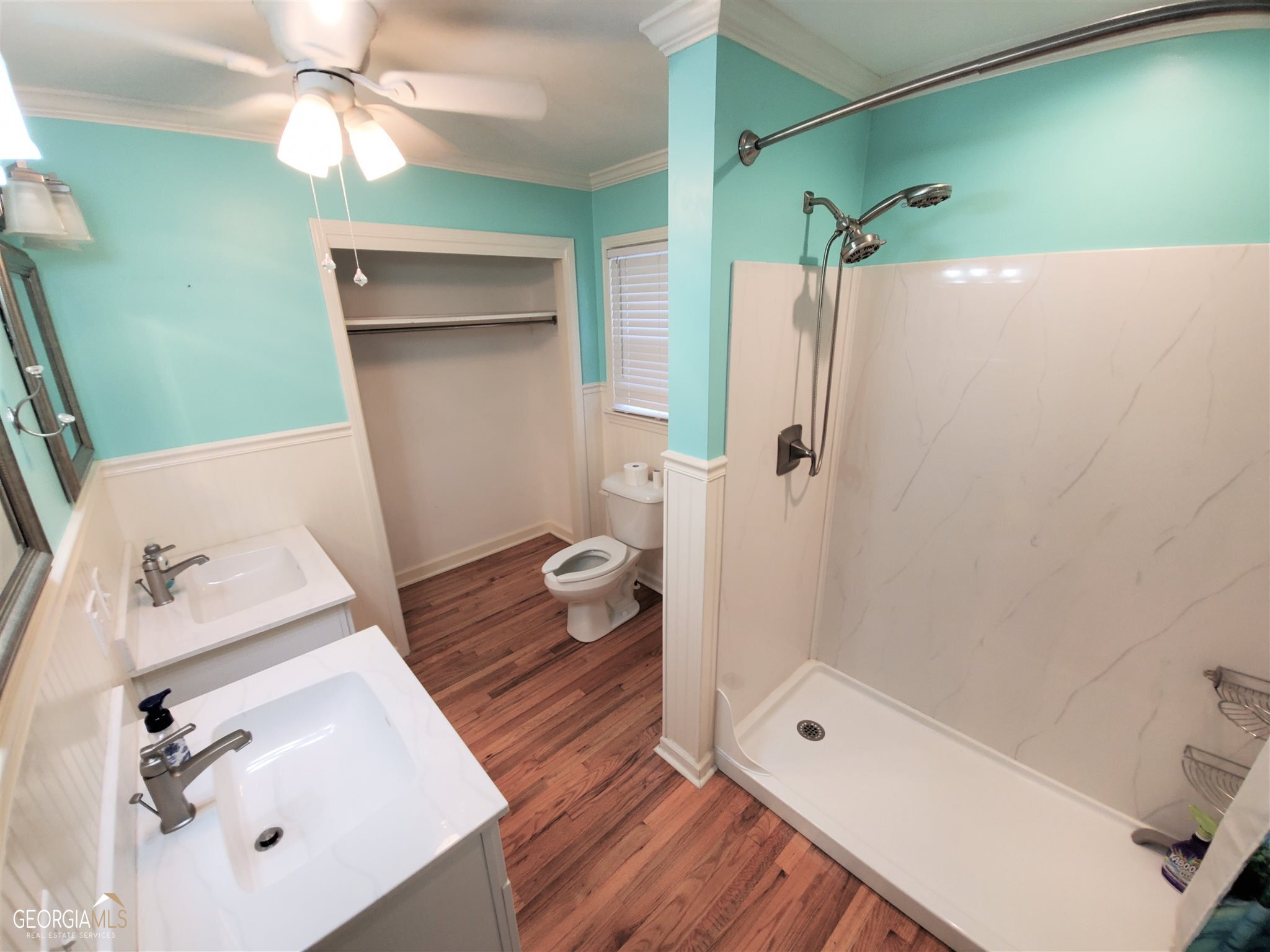 48 Leigh Street Commerce, GA 30529 - Photo 12 of 22 a bathroom with a sink a toilet and shower