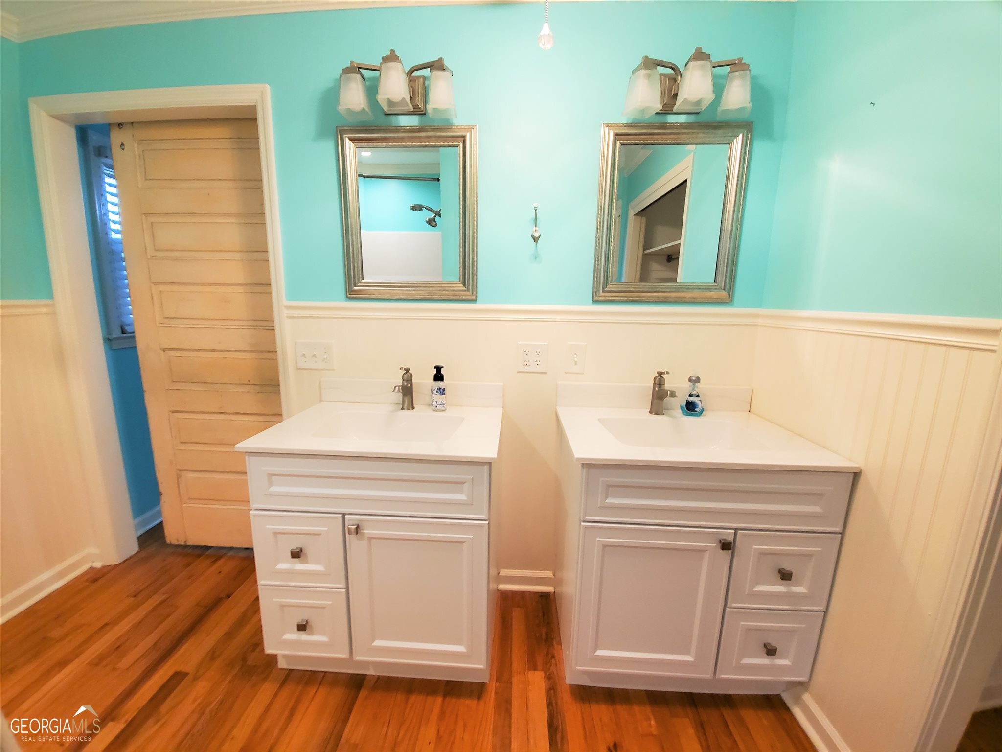 48 Leigh Street Commerce, GA 30529 - Photo 13 of 22 a bathroom with a sink vanity and a mirror